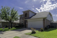 a house with a garage in front of it